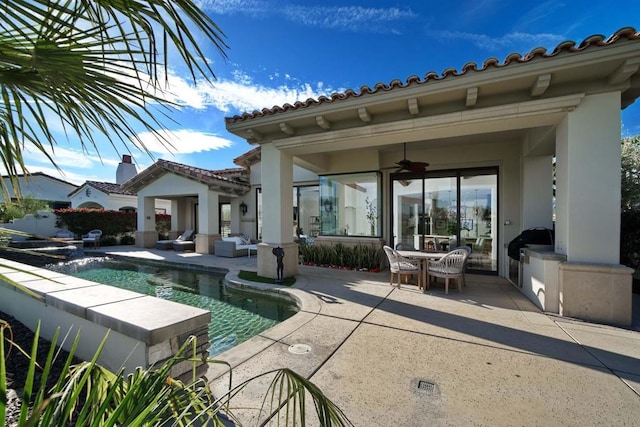 back of house featuring ceiling fan, a fenced in pool, and a patio