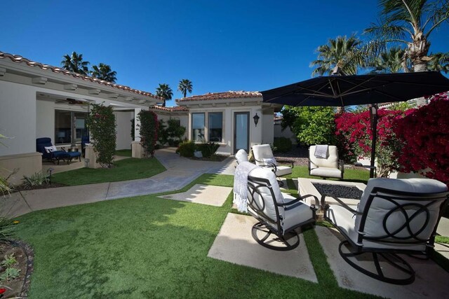 view of yard with an outdoor living space and an outbuilding