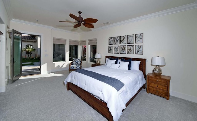 carpeted bedroom featuring ceiling fan and ornamental molding