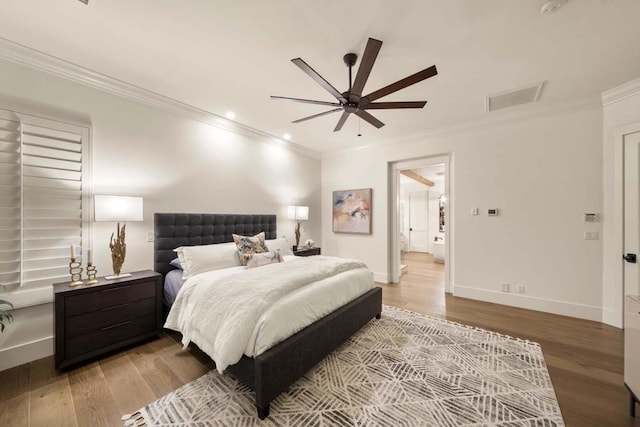 bedroom with ceiling fan, hardwood / wood-style floors, and crown molding