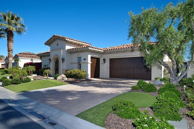 mediterranean / spanish-style home featuring a garage