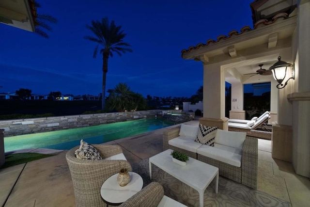 patio at twilight with outdoor lounge area