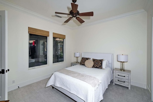 bedroom with ceiling fan, carpet, and ornamental molding