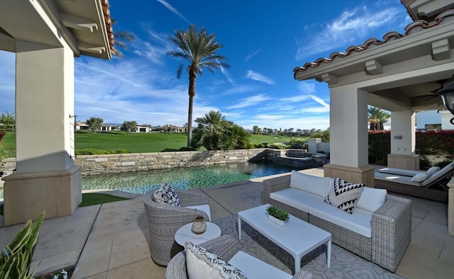 view of patio with an outdoor living space and a water view