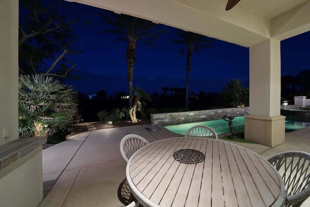 patio at night with ceiling fan