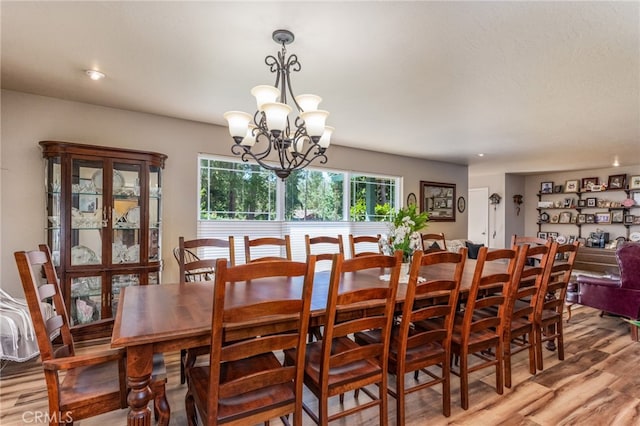 dining room featuring a chandelier and hardwood / wood-style flooring