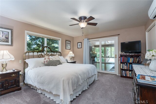 bedroom featuring ceiling fan, an AC wall unit, carpet floors, and access to outside