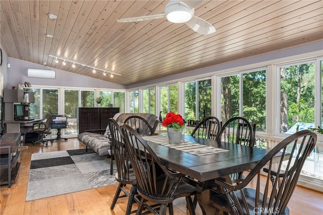 sunroom with rail lighting, a wall unit AC, wooden ceiling, ceiling fan, and lofted ceiling