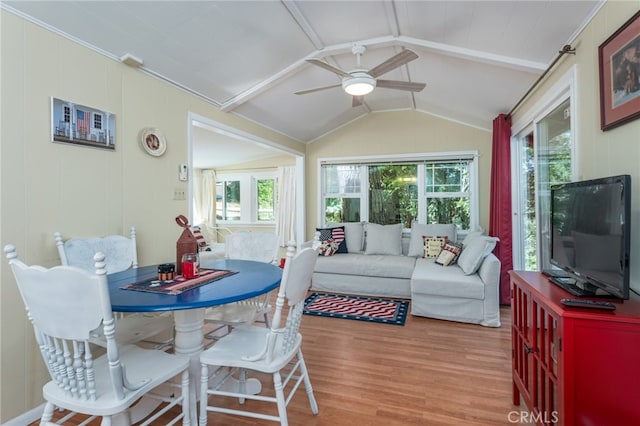 sunroom featuring ceiling fan, a wealth of natural light, and lofted ceiling