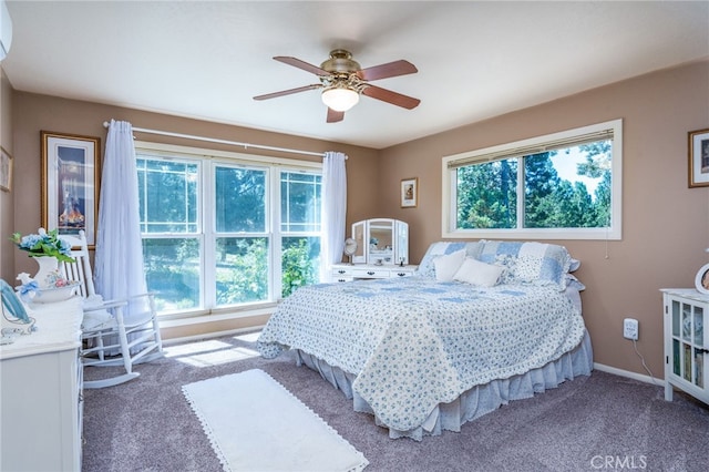 bedroom with ceiling fan and carpet floors