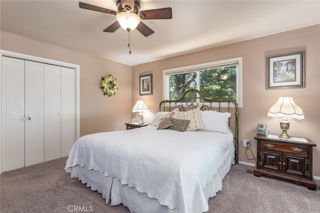 bedroom with light carpet, ceiling fan, and a closet