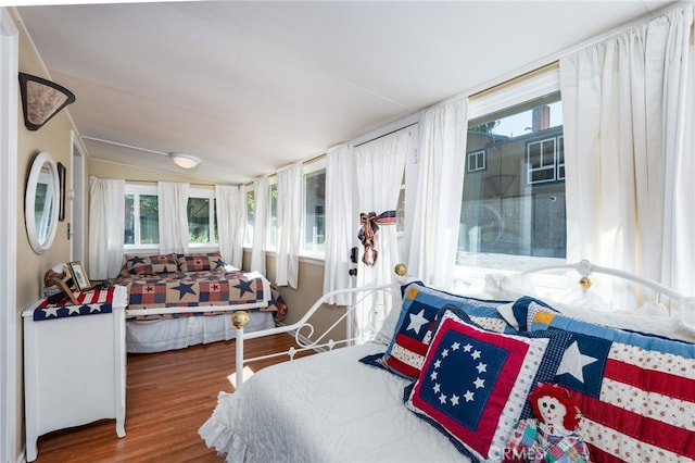 bedroom featuring vaulted ceiling and hardwood / wood-style floors