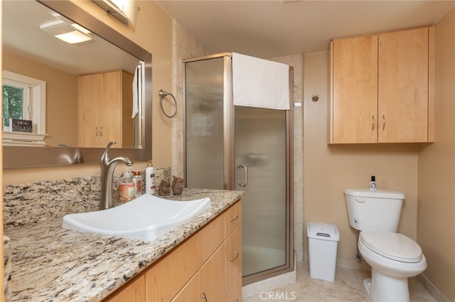 bathroom with toilet, tile patterned floors, an enclosed shower, and vanity