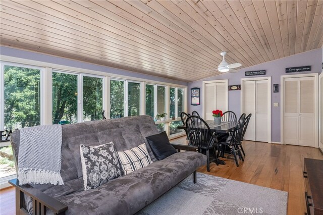 living room with lofted ceiling, ceiling fan, wood ceiling, and hardwood / wood-style flooring