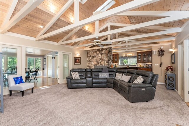 living room featuring ceiling fan, high vaulted ceiling, a wealth of natural light, and carpet flooring