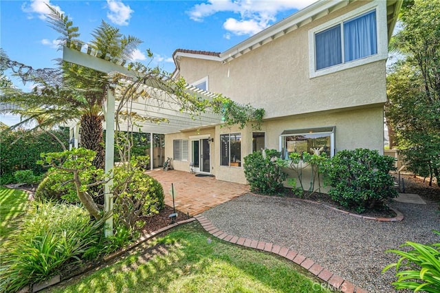 rear view of property featuring a patio