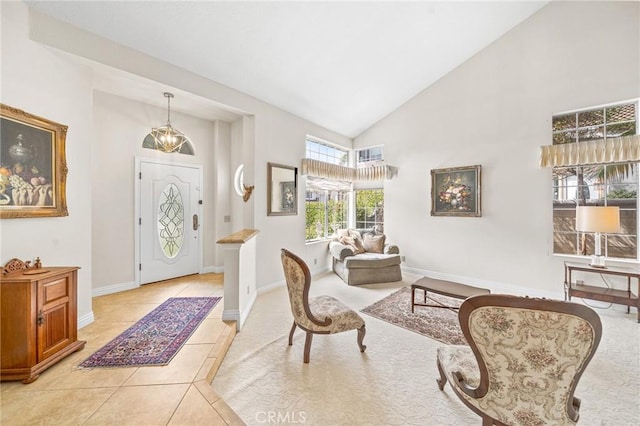 tiled entrance foyer featuring lofted ceiling