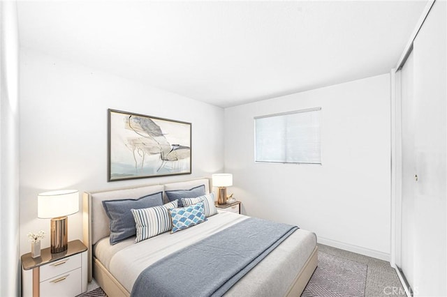 bedroom with light colored carpet