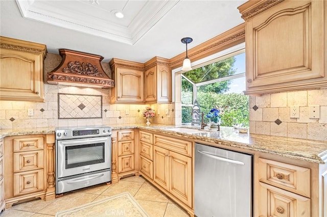 kitchen with stainless steel appliances, decorative backsplash, ornamental molding, a tray ceiling, and custom range hood