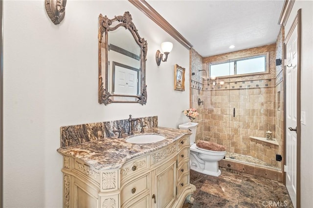 bathroom featuring toilet, ornamental molding, a tile shower, and vanity