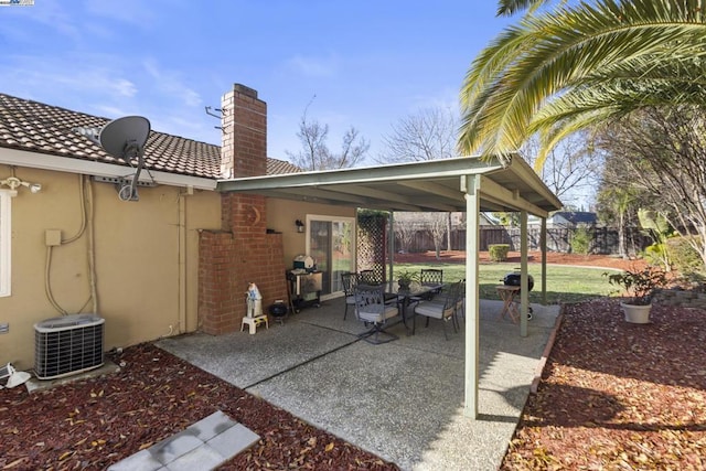 view of patio with cooling unit and a grill