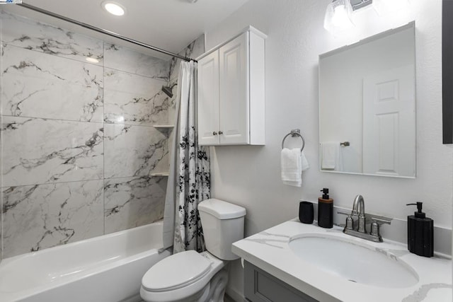 full bathroom featuring toilet, shower / bathtub combination with curtain, and vanity