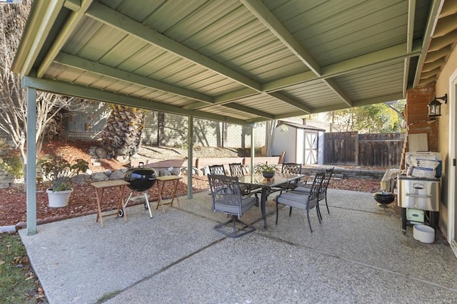 view of patio with a storage shed