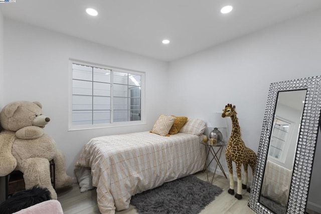 bedroom with light hardwood / wood-style flooring