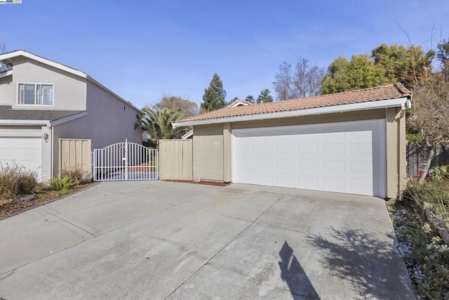 view of side of home featuring a garage