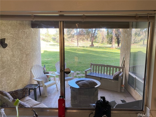 view of patio with a fire pit