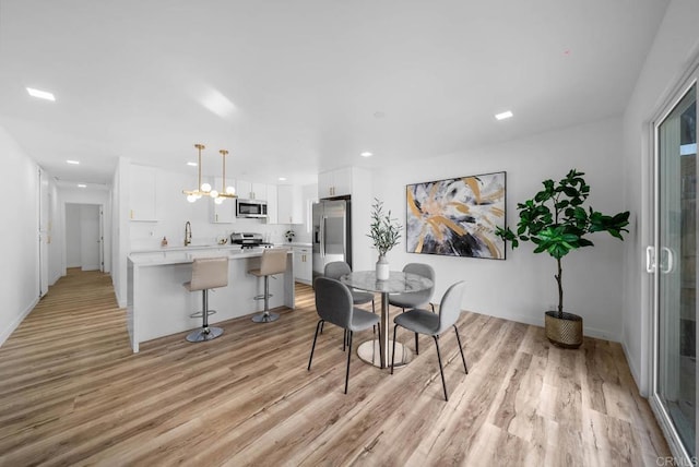 dining room featuring light hardwood / wood-style floors