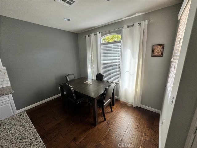 dining room featuring dark hardwood / wood-style flooring