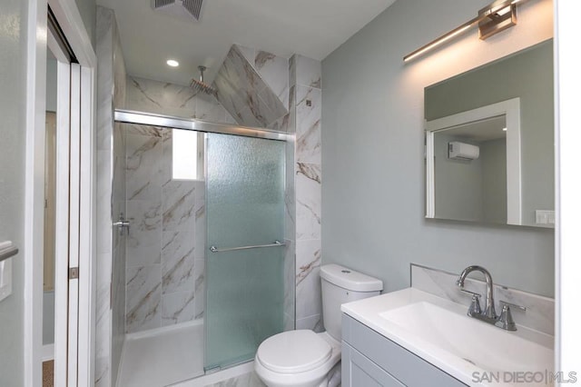 bathroom with walk in shower, vanity, and toilet