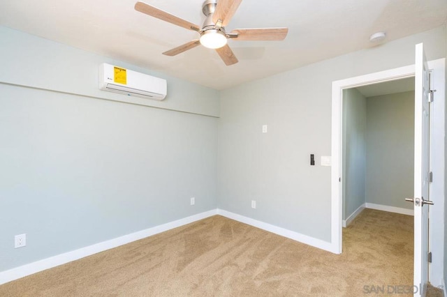 unfurnished room with ceiling fan, light colored carpet, and a wall mounted air conditioner