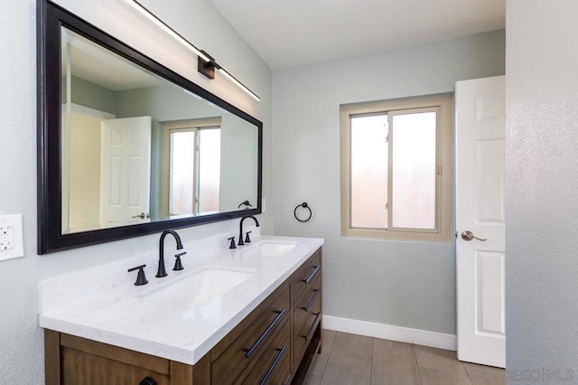 bathroom featuring plenty of natural light and vanity