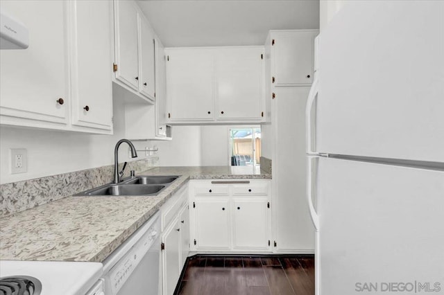 kitchen featuring sink, white appliances, white cabinets, and dark hardwood / wood-style flooring