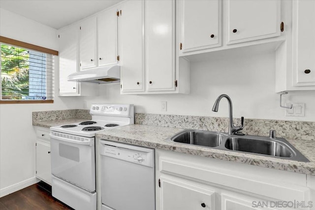 kitchen featuring dark wood-type flooring, sink, white cabinets, and white appliances