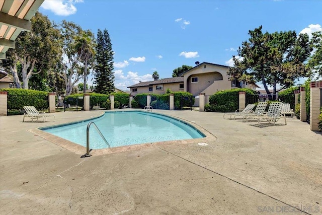 view of swimming pool featuring a patio area