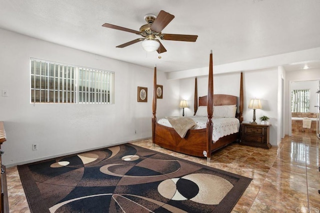 bedroom featuring ceiling fan and connected bathroom