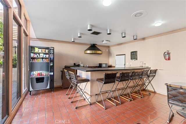 bar featuring crown molding