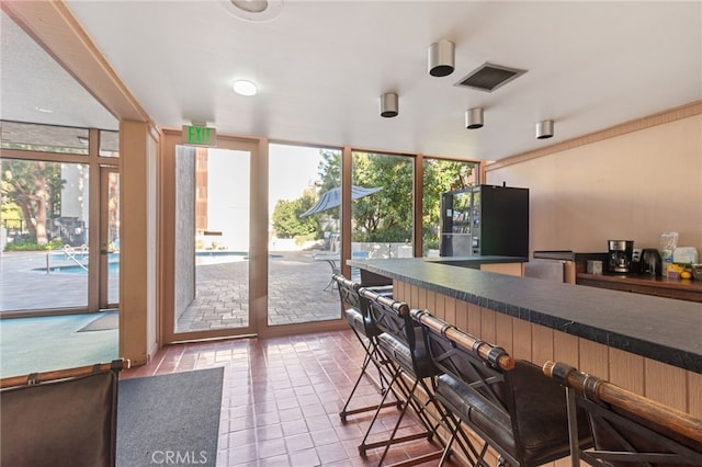 interior space with a wealth of natural light and tile patterned flooring