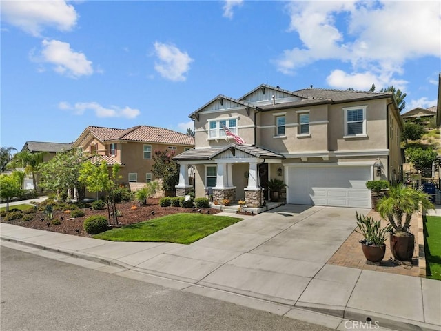 view of front of property featuring a front yard and a garage