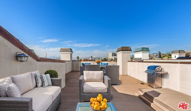 view of patio with grilling area and an outdoor living space