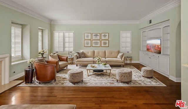 living room featuring hardwood / wood-style flooring, plenty of natural light, and crown molding