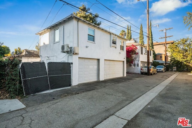 view of property exterior with a garage