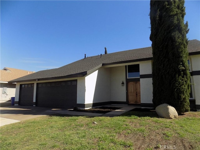 ranch-style house with a front lawn and a garage