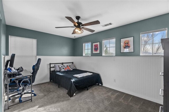 bedroom with ceiling fan and carpet flooring