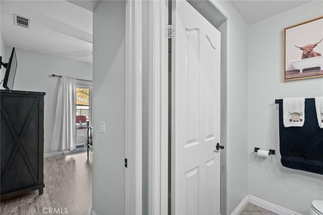 bathroom featuring hardwood / wood-style flooring