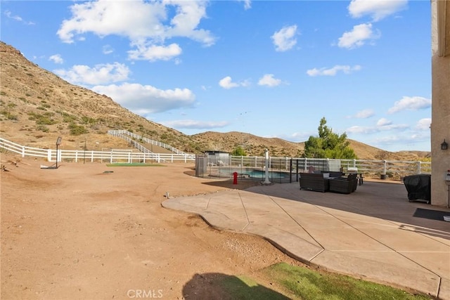 exterior space with a rural view and a mountain view