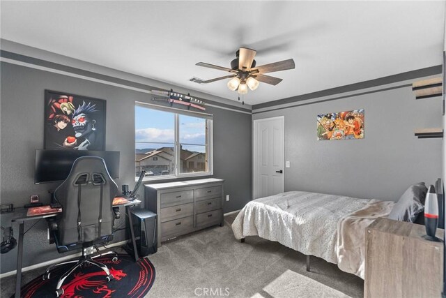 bedroom featuring ceiling fan and light colored carpet